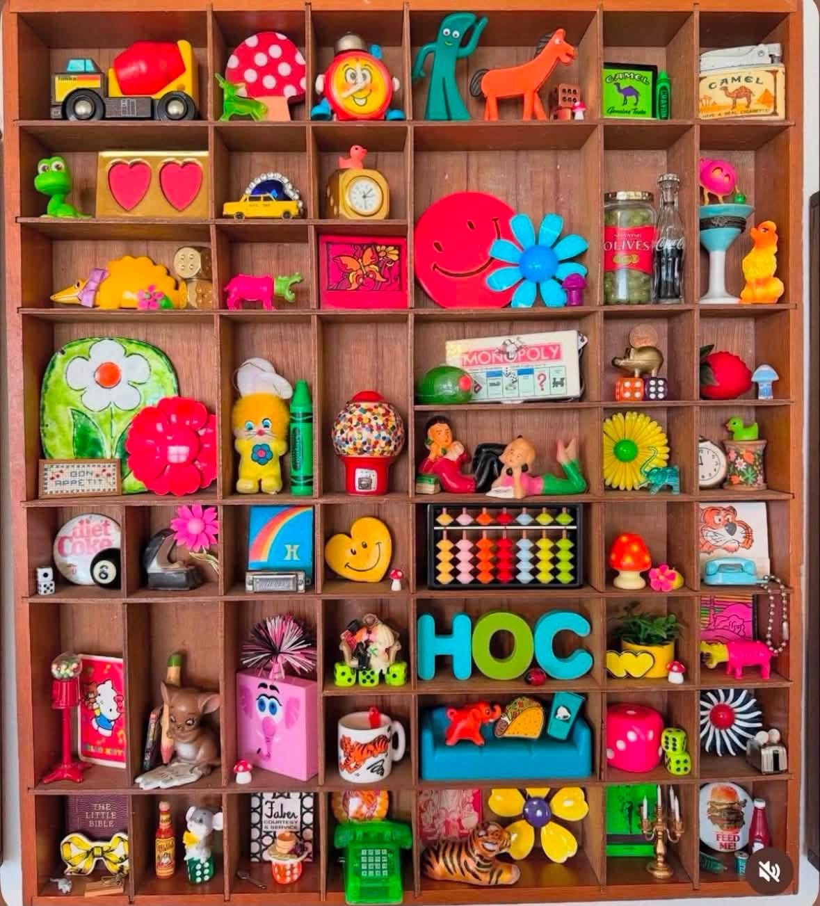 House of Coop’s colorful miniature treasures in a wooden compartment shelf