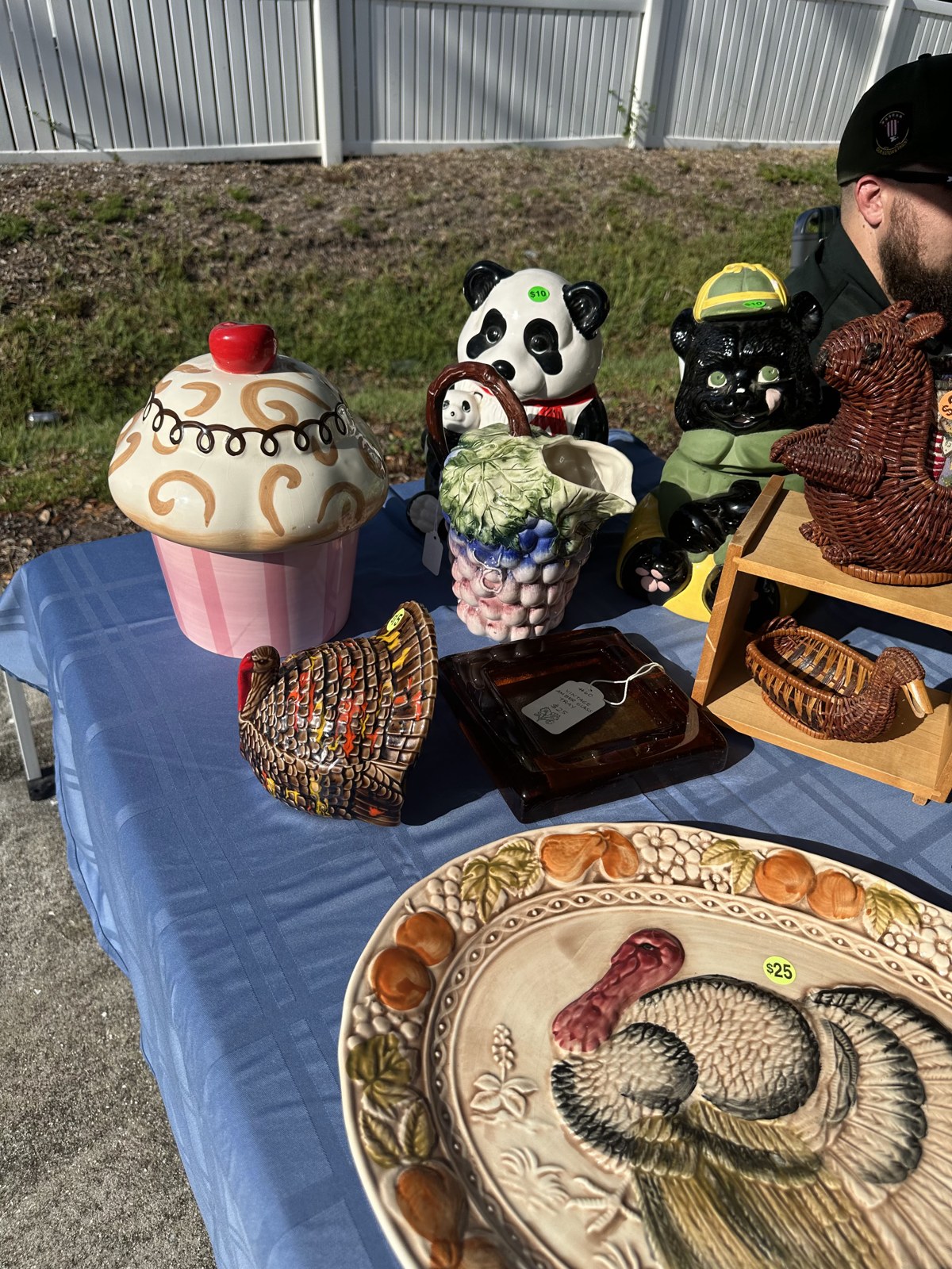 Ceramic collectibles and a rooster plate displayed at the July vintage-market pop-up