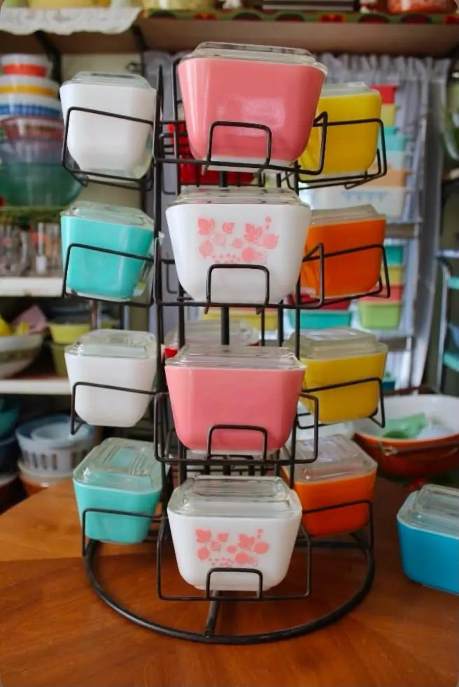 Small colorful refrigerator dishes on a rotating metal rack