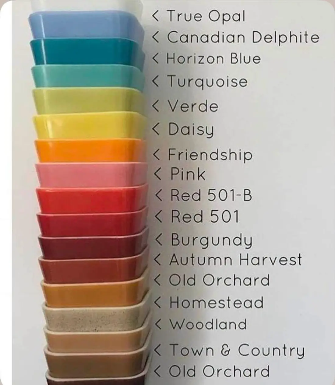 Stacked Pyrex refrigerator dishes with labeled color names