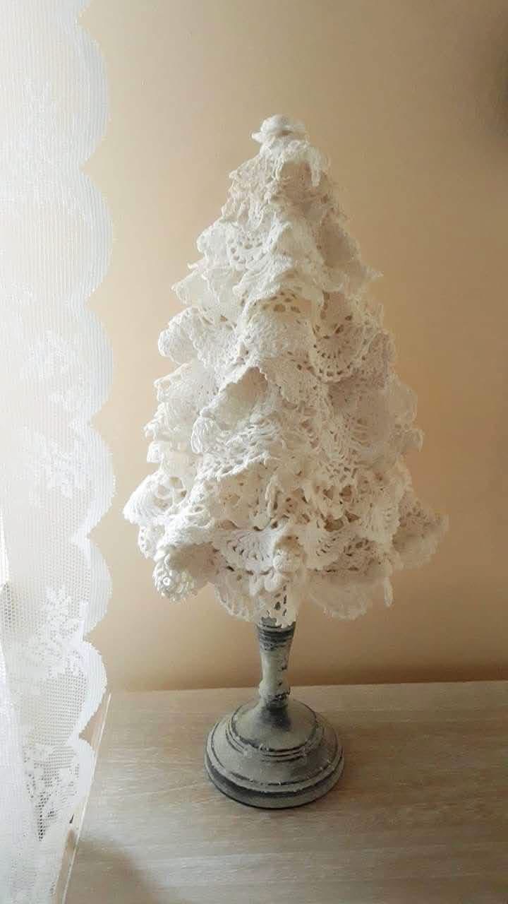 A tabletop Christmas tree made from layered cream doilies