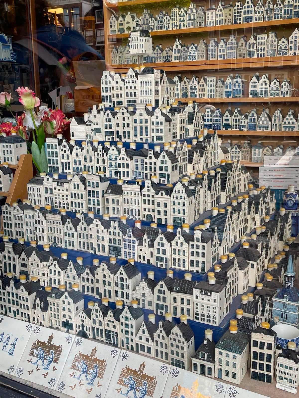 Rows of blue and white miniature Delft houses in a shop window