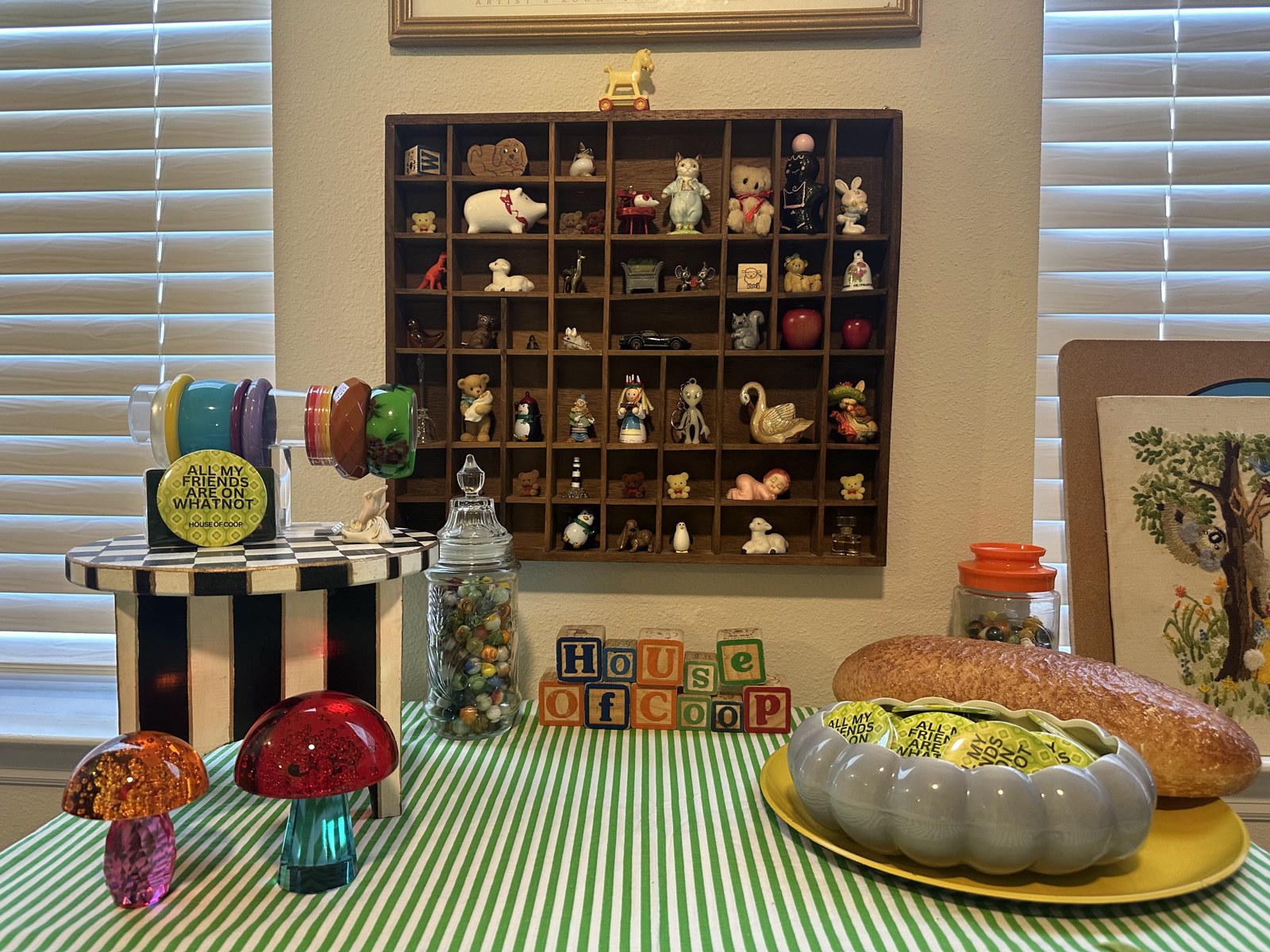 Guest-room display with tiny collectibles, vintage bracelets and House of Coop blocks