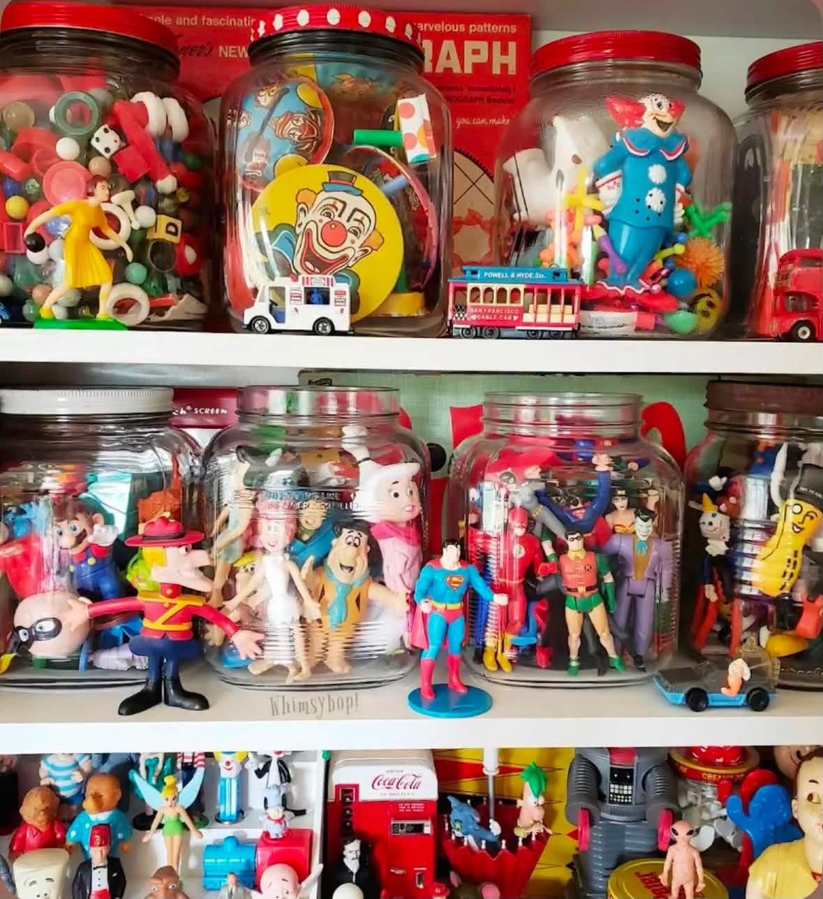 Glass jars filled with tiny toys and character figures