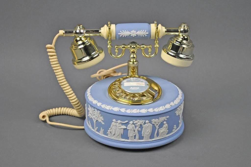 Blue relief-decorated telephone with gold-colored hardware