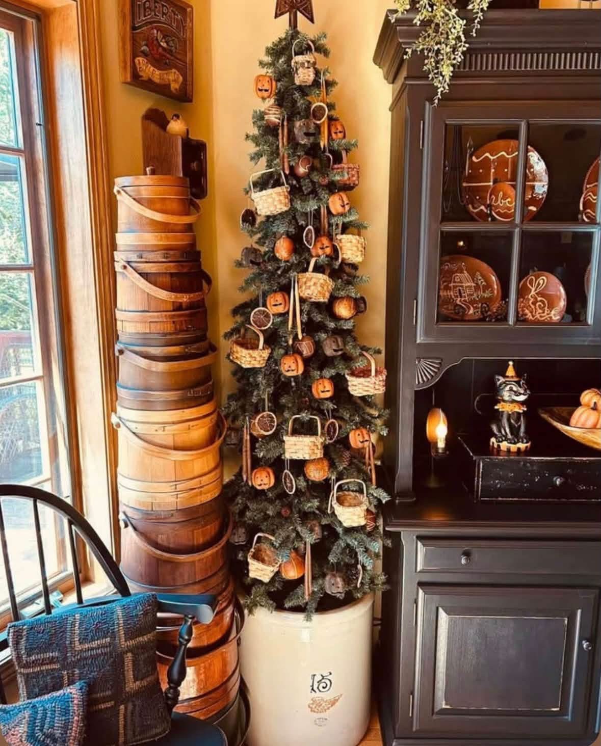 Narrow autumn tree with pumpkin ornaments and miniature baskets