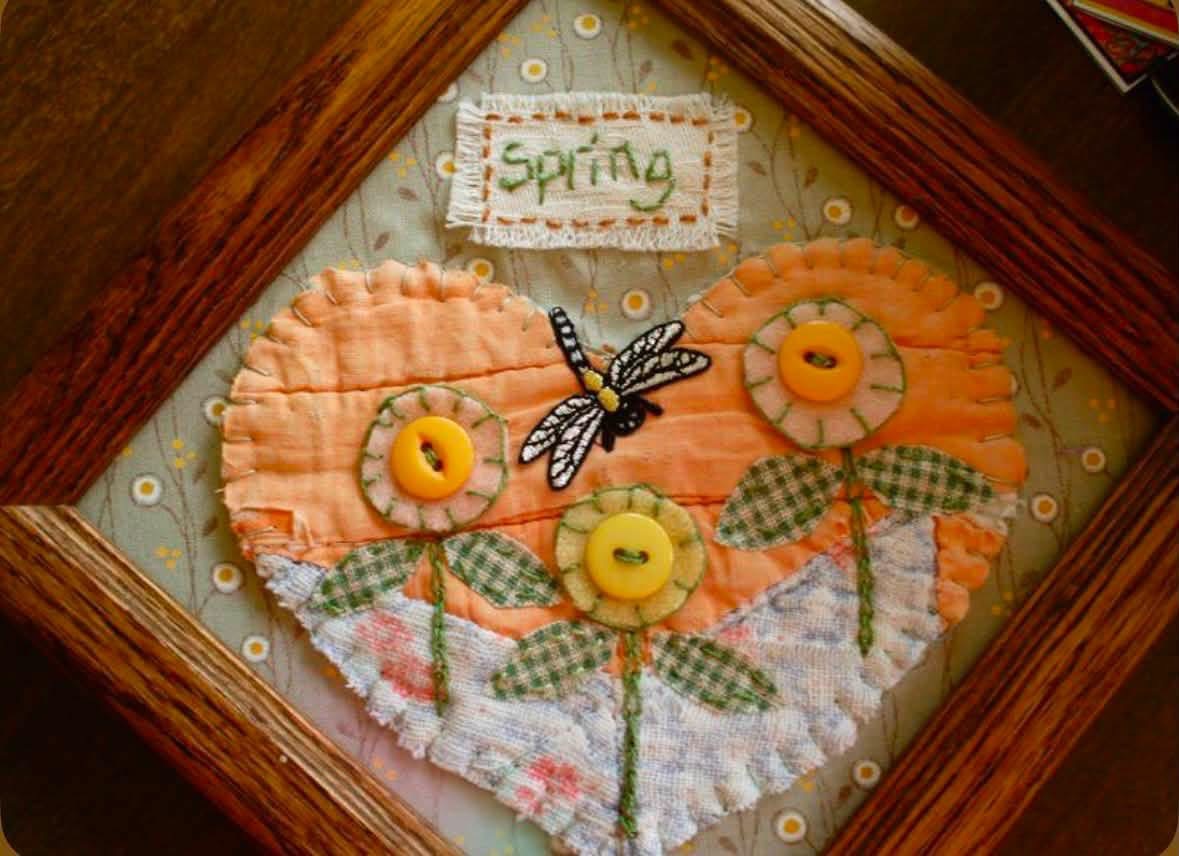 Framed textile heart with button flowers and a dragonfly