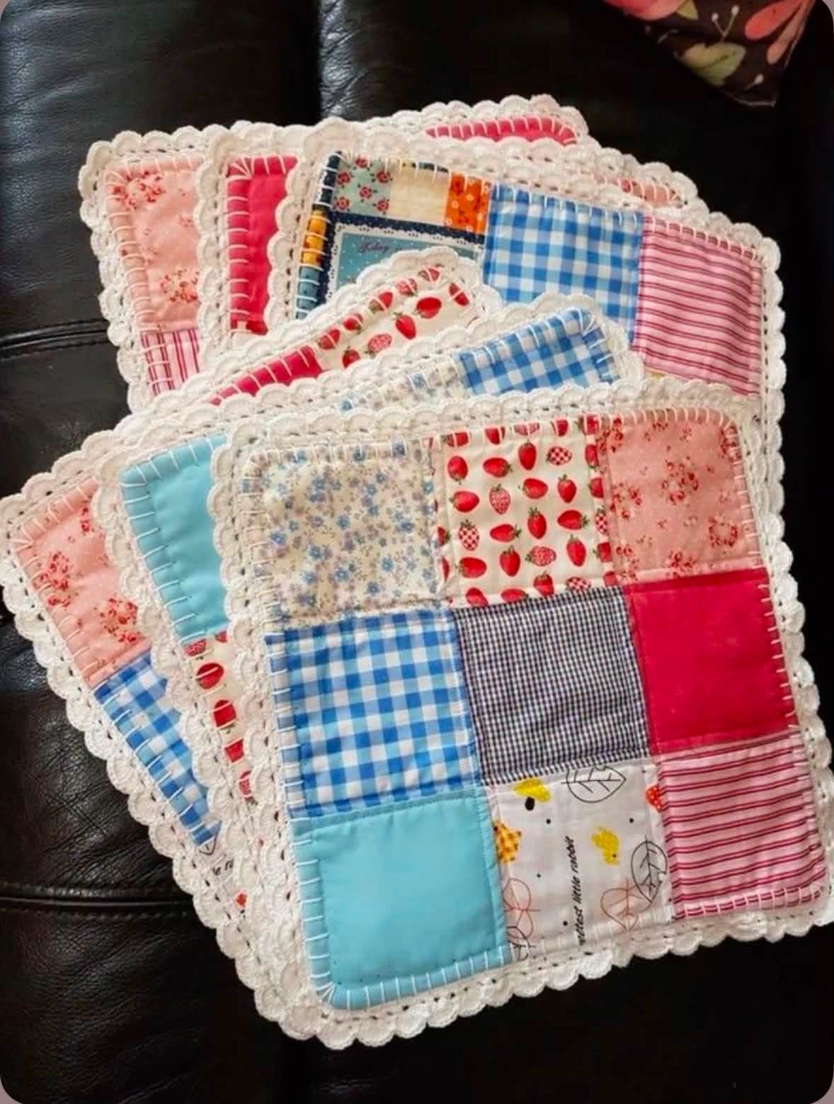 Colorful patchwork mats edged with white crochet