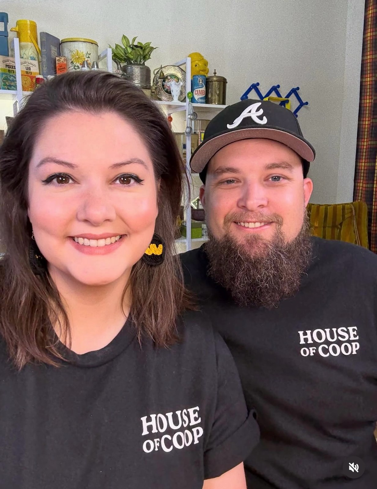 Ashley and Jacob together in their studio wearing black House of Coop shirts