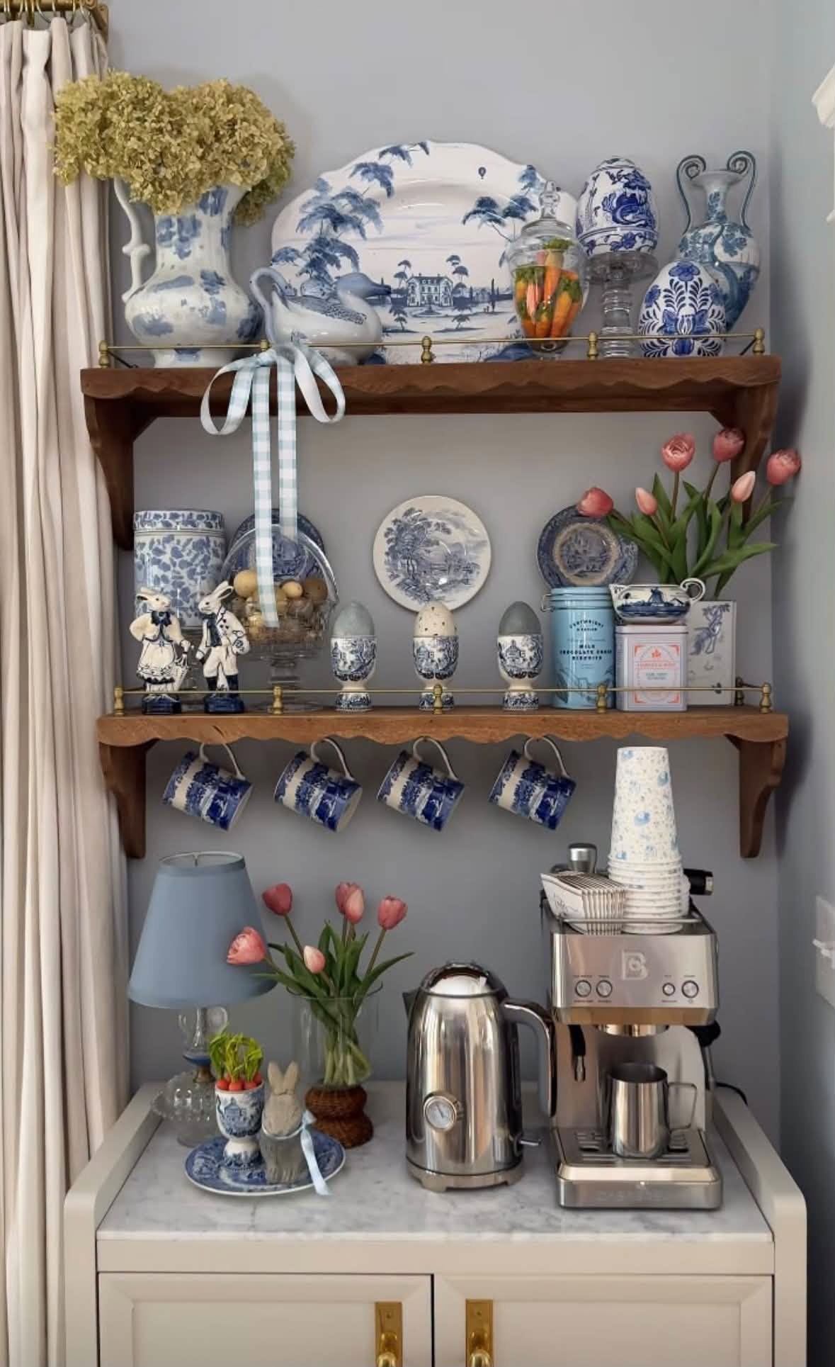 A coffee corner styled with blue and white pottery and spring flowers