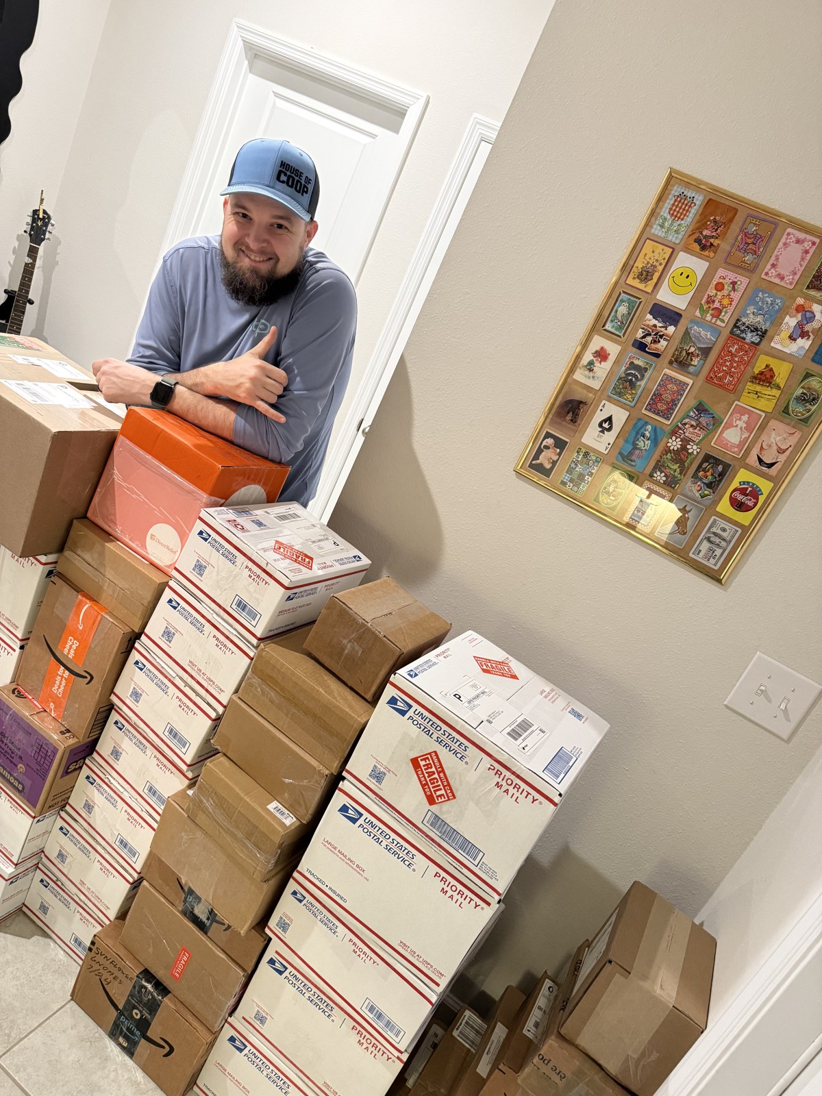 A seller beside packed parcels in the new studio