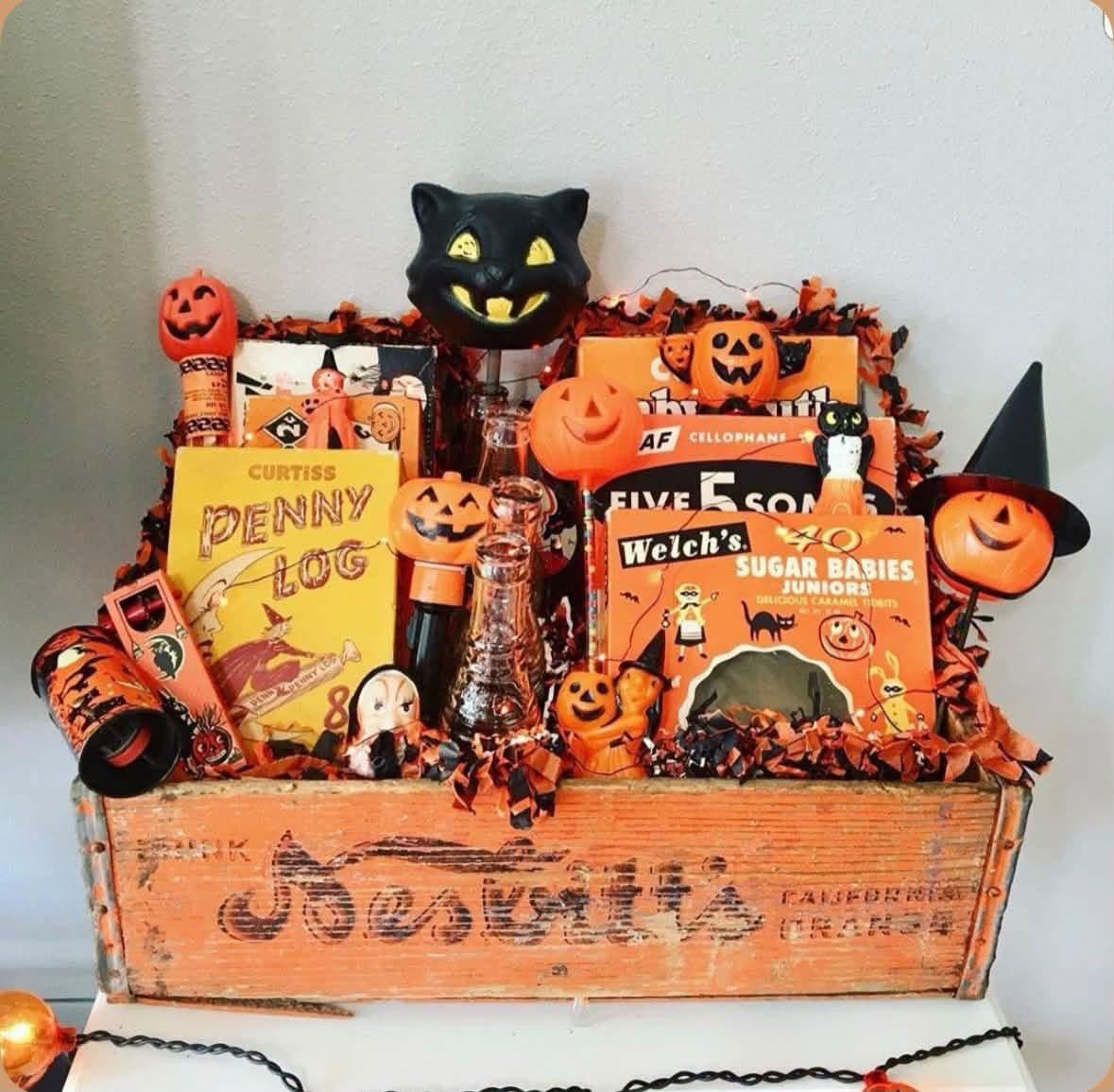 Vintage wooden crate filled with nostalgic Halloween decorations