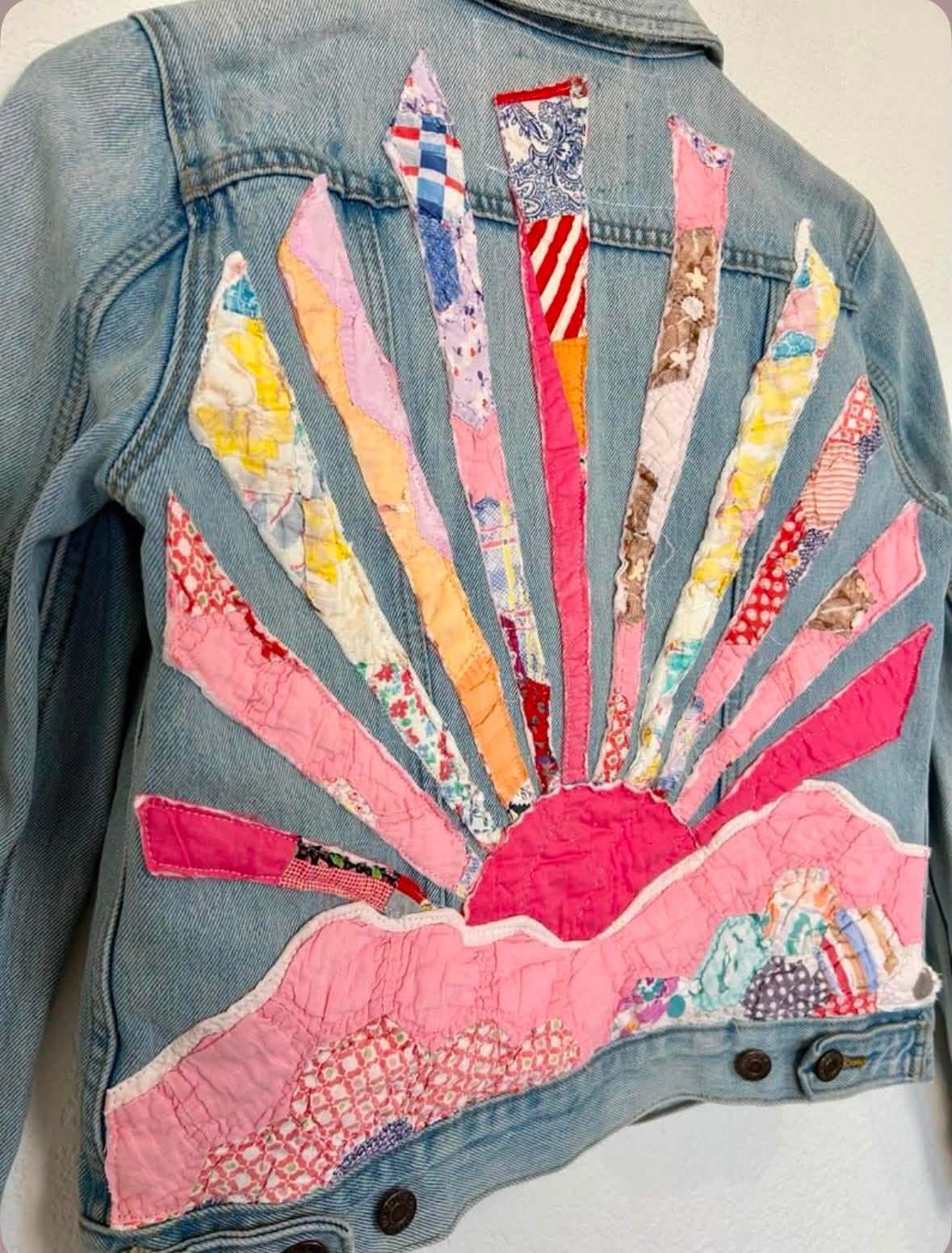Denim jacket decorated with a pink patchwork sunrise