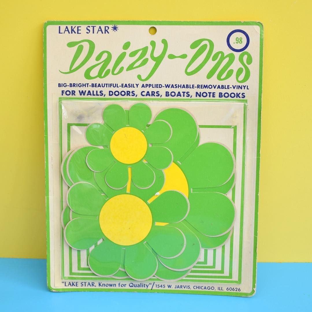 Packaged green daisy vinyl decorations