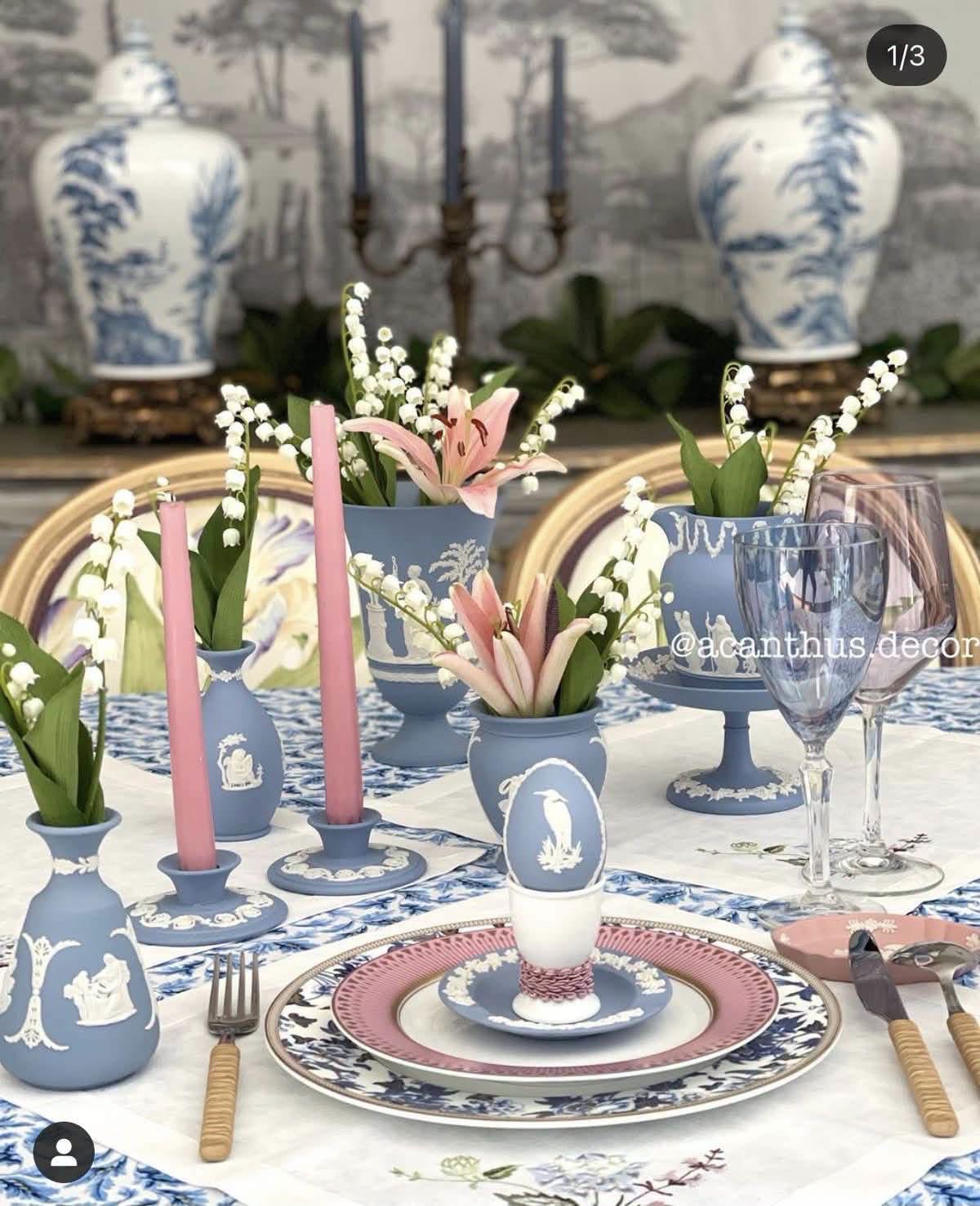 Blue Jasperware vases and candleholders in a floral table setting, with original acanthus decor credit