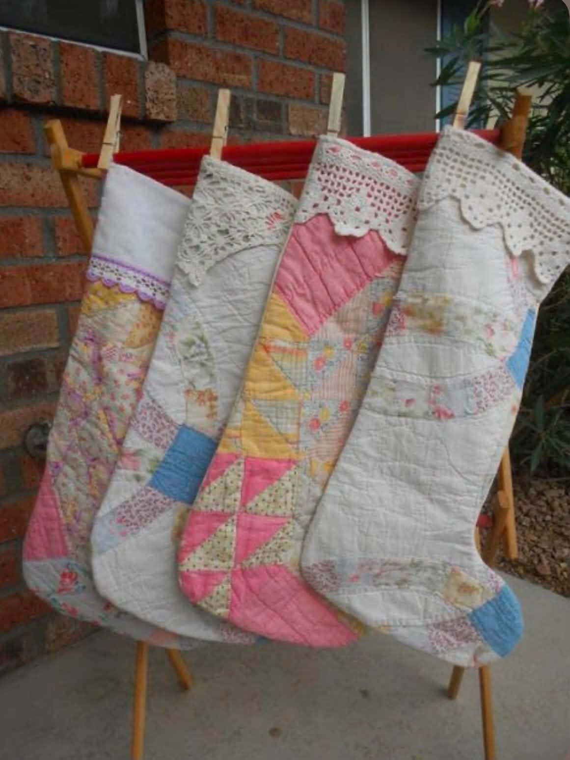Pastel quilted Christmas stockings hanging from a rack