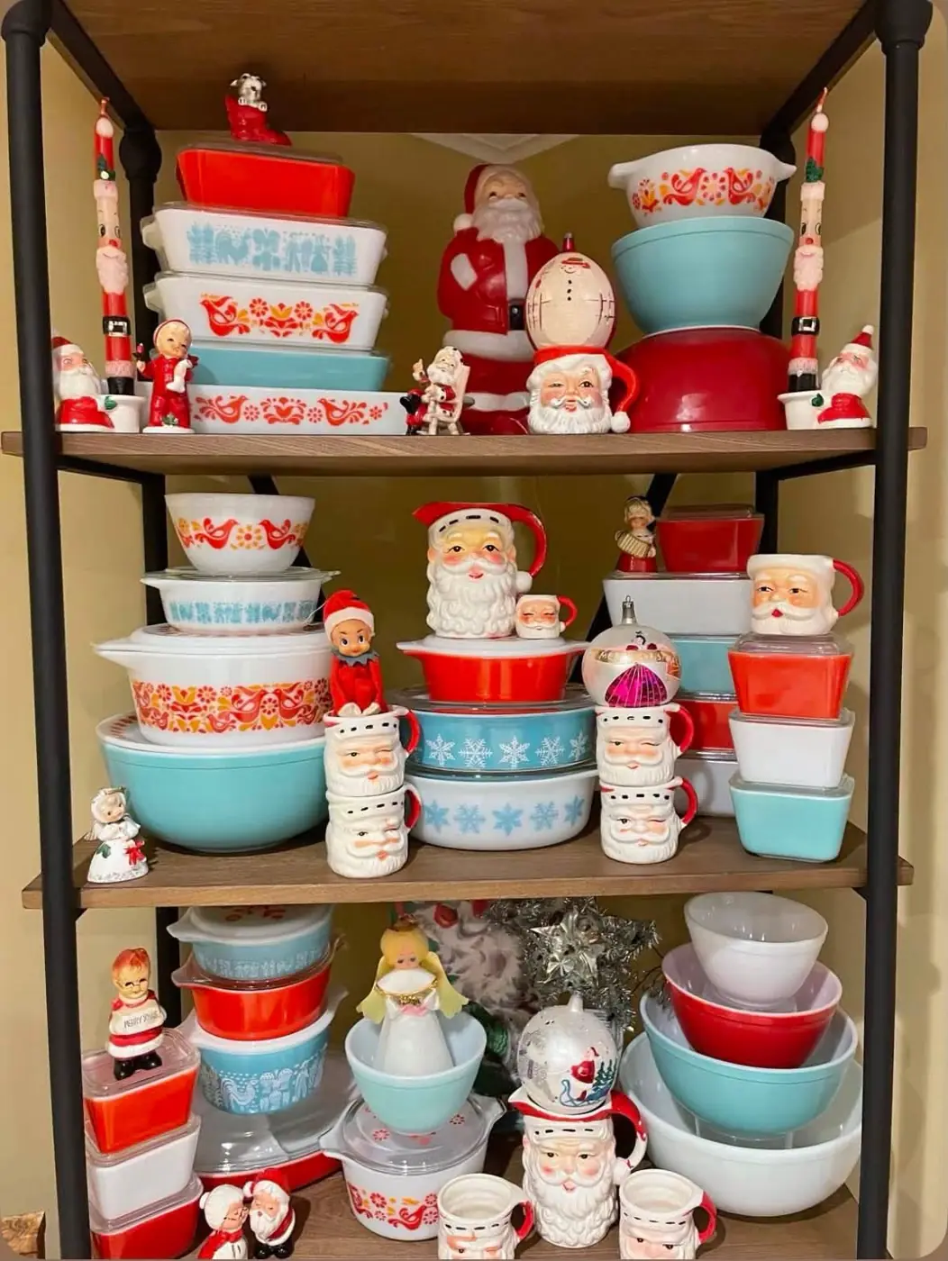 Red and turquoise Pyrex displayed with vintage Santa decorations