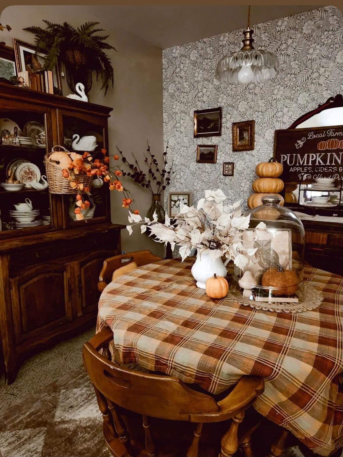 Vintage dining room with plaid tablecloth and autumn decorations