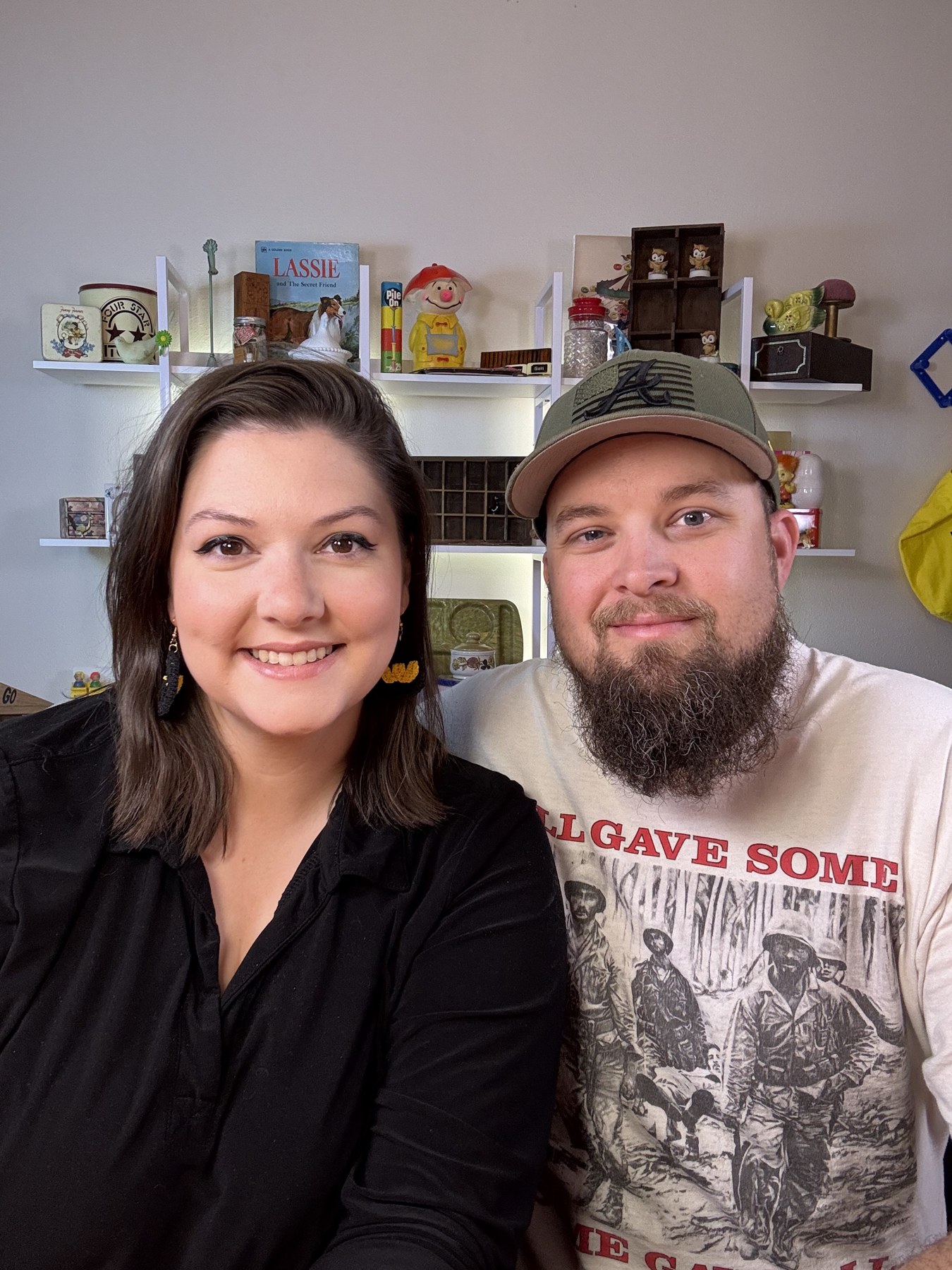 Ashley and Jacob together in front of shelves of vintage finds