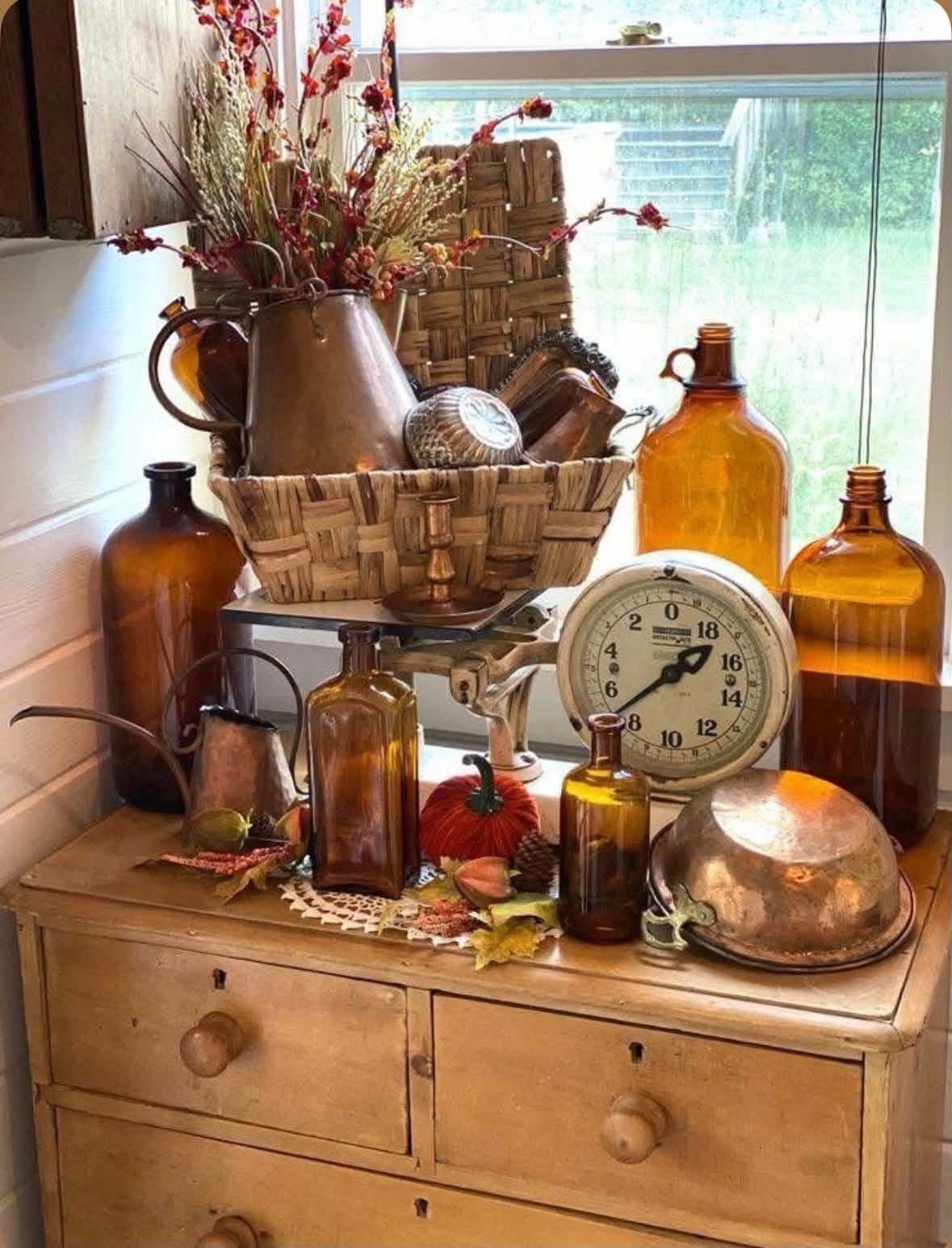 Amber glass and copper pieces gathered around a vintage scale