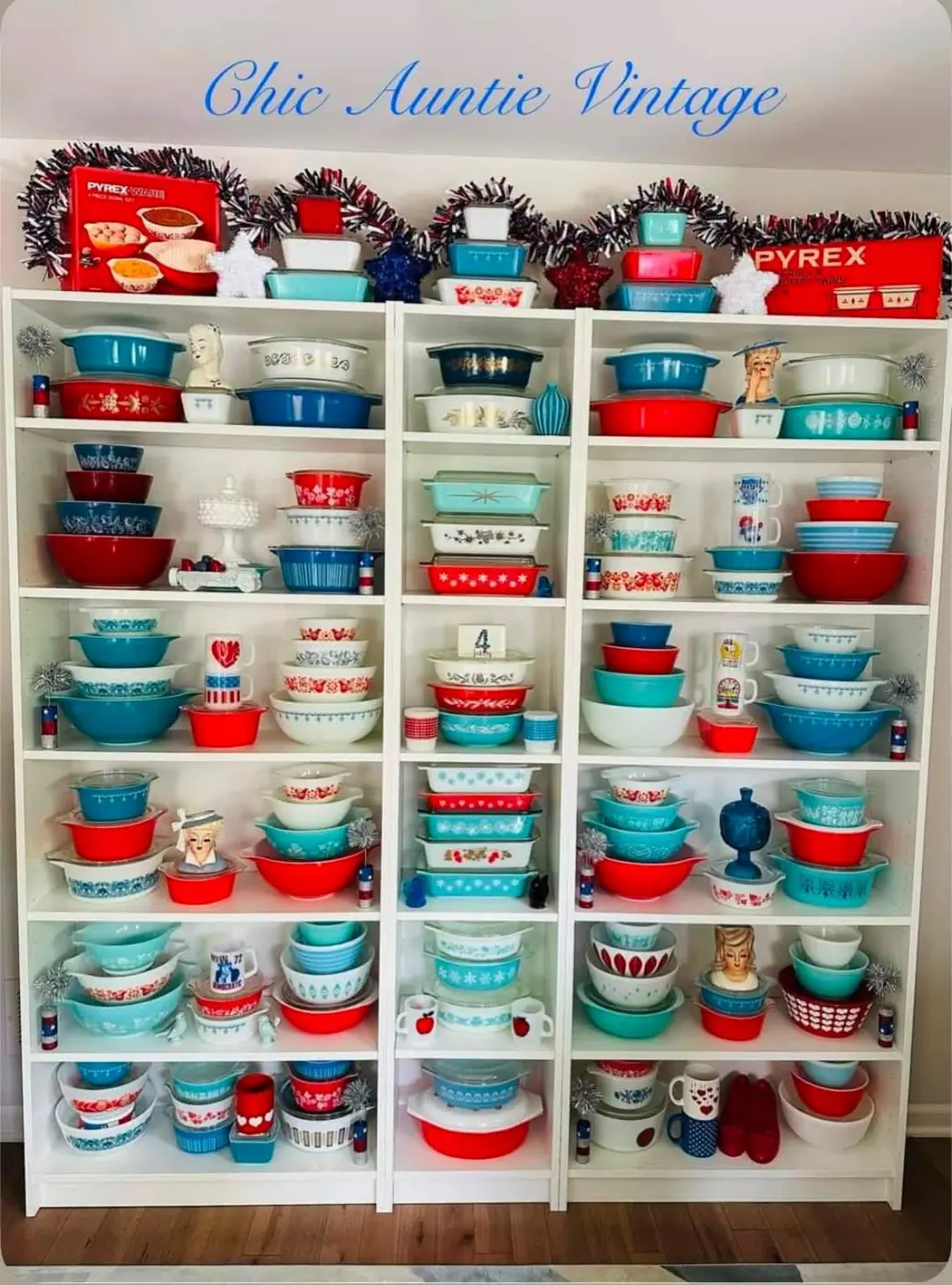Red white and blue Pyrex collection in a white display cabinet