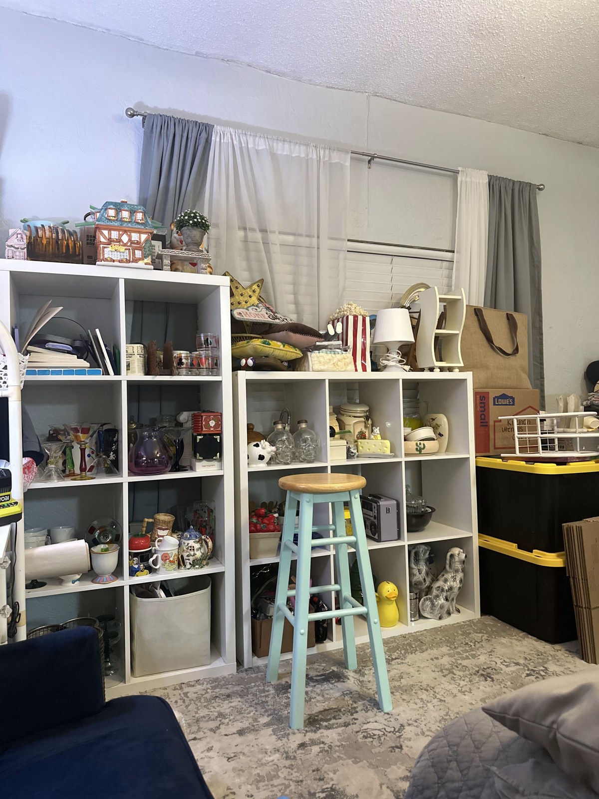 Vintage pieces arranged on white shelves in the October 2023 apartment