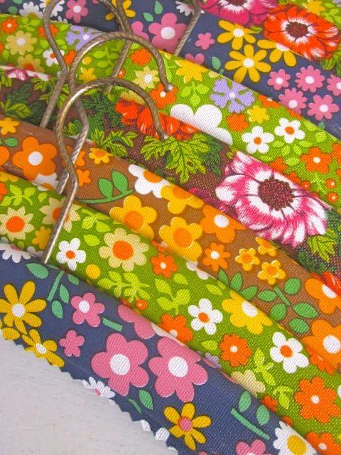 Clothes hangers covered in colorful floral fabric
