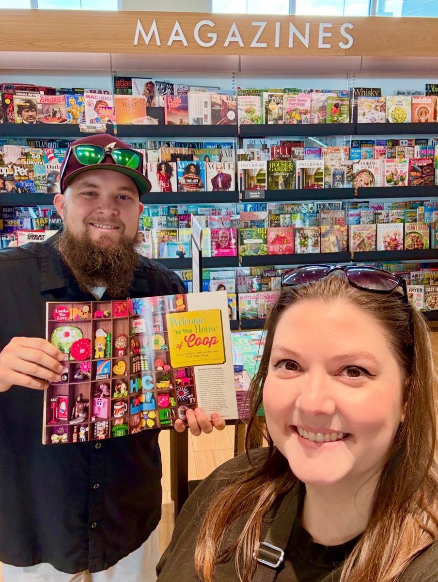 Ashley and Jacob at the bookstore holding their House of Coop feature in Flea Market Decor