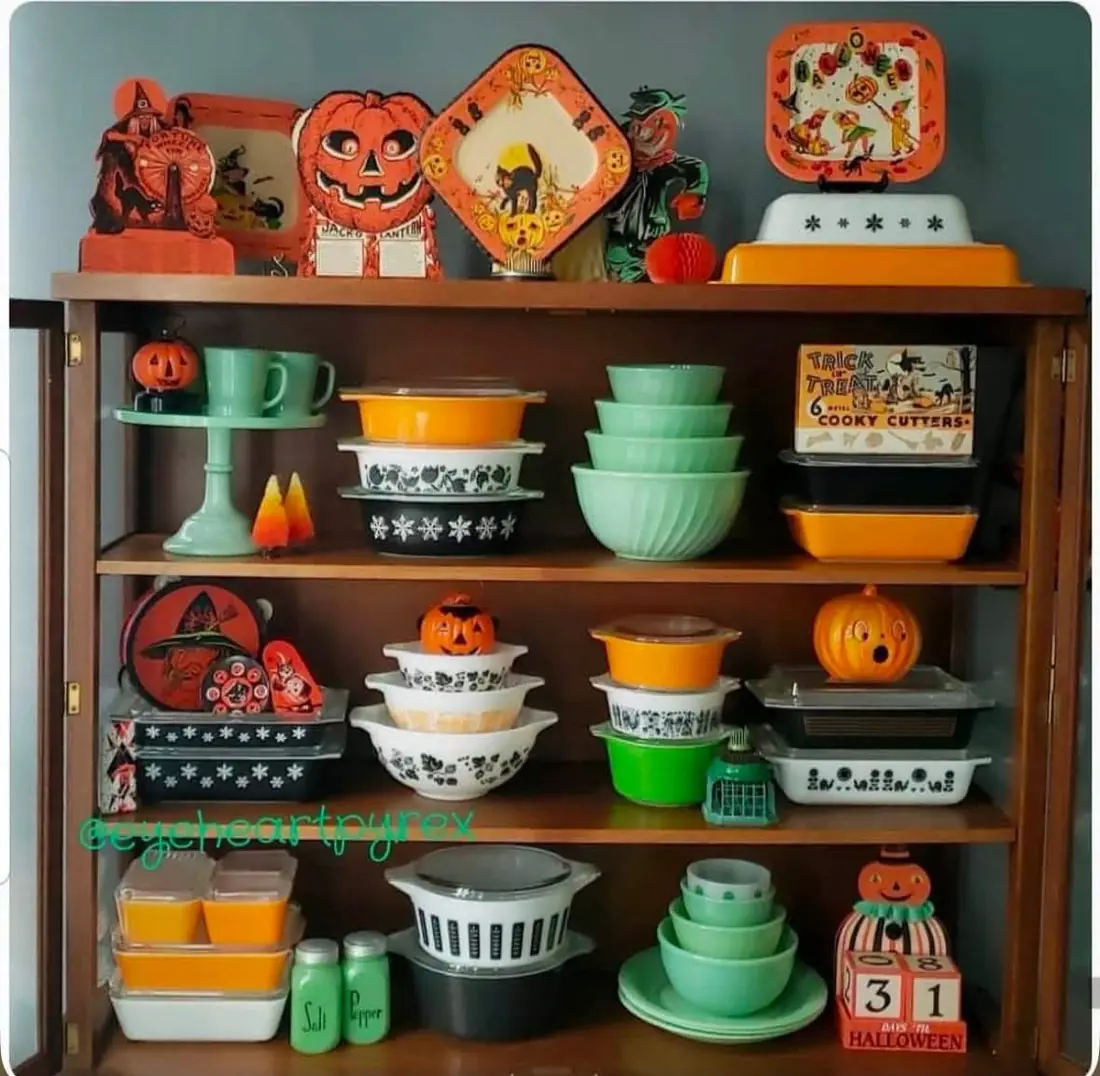Halloween display with black orange and green kitchenware