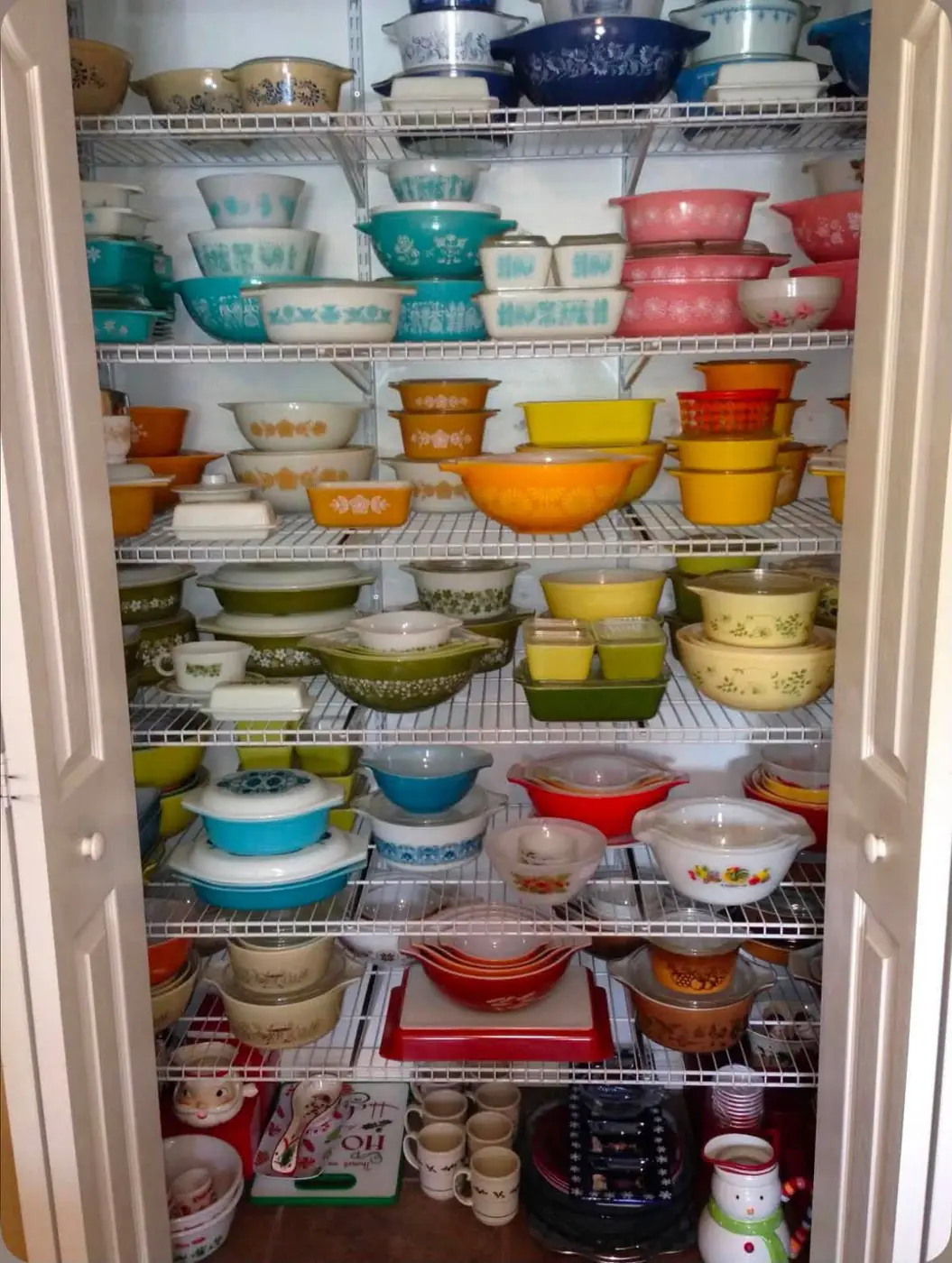 Colorful Pyrex collection on pantry shelves