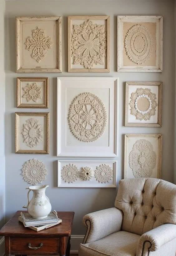 Cream doilies in pale frames above a chair and side table